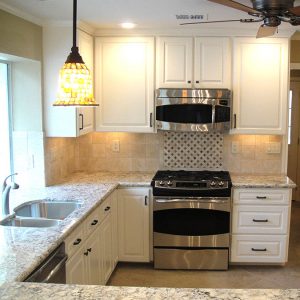 Custom built kitchen and breakfast room featured