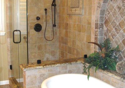 Elegant master bathroom with pedestal tub featured