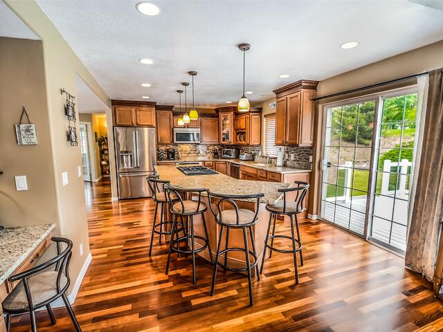 brown kitchen with hardwood flooring